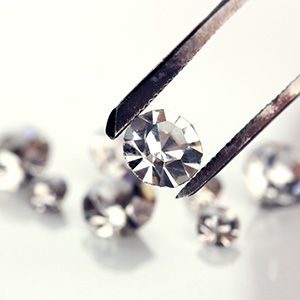 Examining one of a group of small diamonds