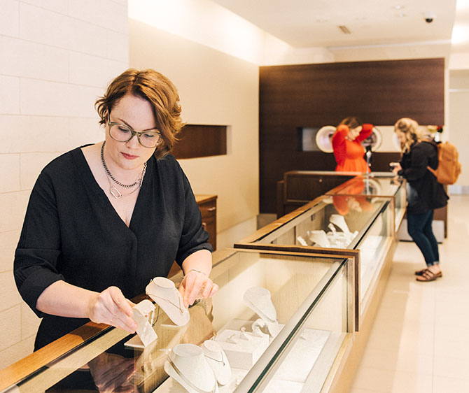 Vesilind familiarizes herself with the store’s wide inventory of fashion and bridal jewels.