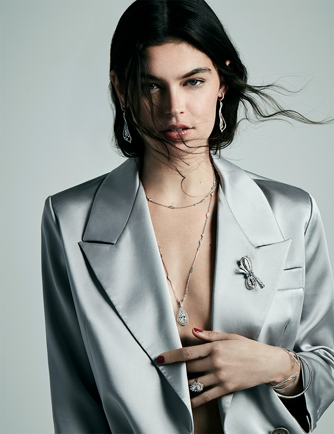 model with blazer and giant diamond pendant