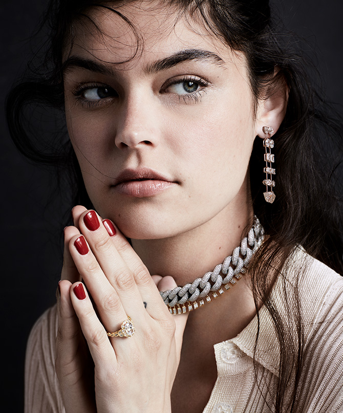 model with chain collar and double drop earrings