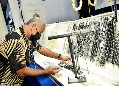 Man looking at pearls