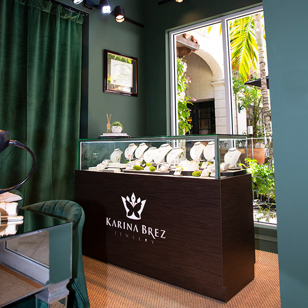 Tones of emerald and gold highlight the interior of the new Karina Brez Jewelry store 