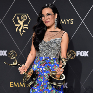 Ali Wong holding two Emmy Awards