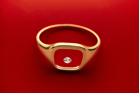 Gold signet ring with lab-grown diamond in the center by Ana Luisa
