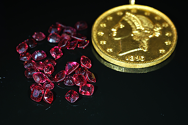 Red spinels 24k gold medallion photo by Sam Cooley