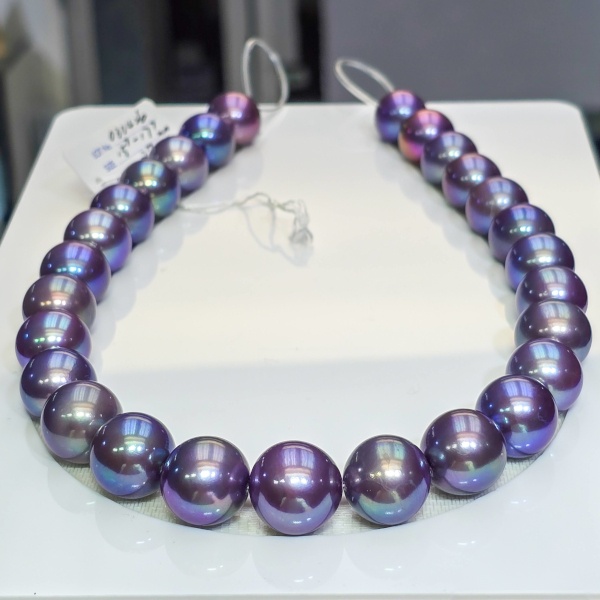 A strand of 15-18 mm purple pearls sold by Yen's Jewelry, price upon request